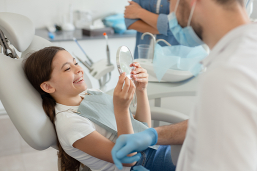 Dr. Sekhon treating a patient in Ottawa at her dental office on Carling