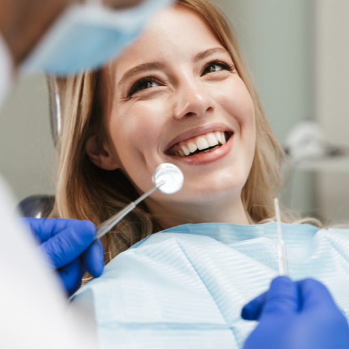 shutterstock_1389890039 dental hygienist preparing a patient for a dental implant procedure