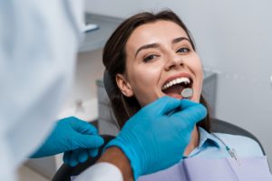 woman smiling during physical inspection