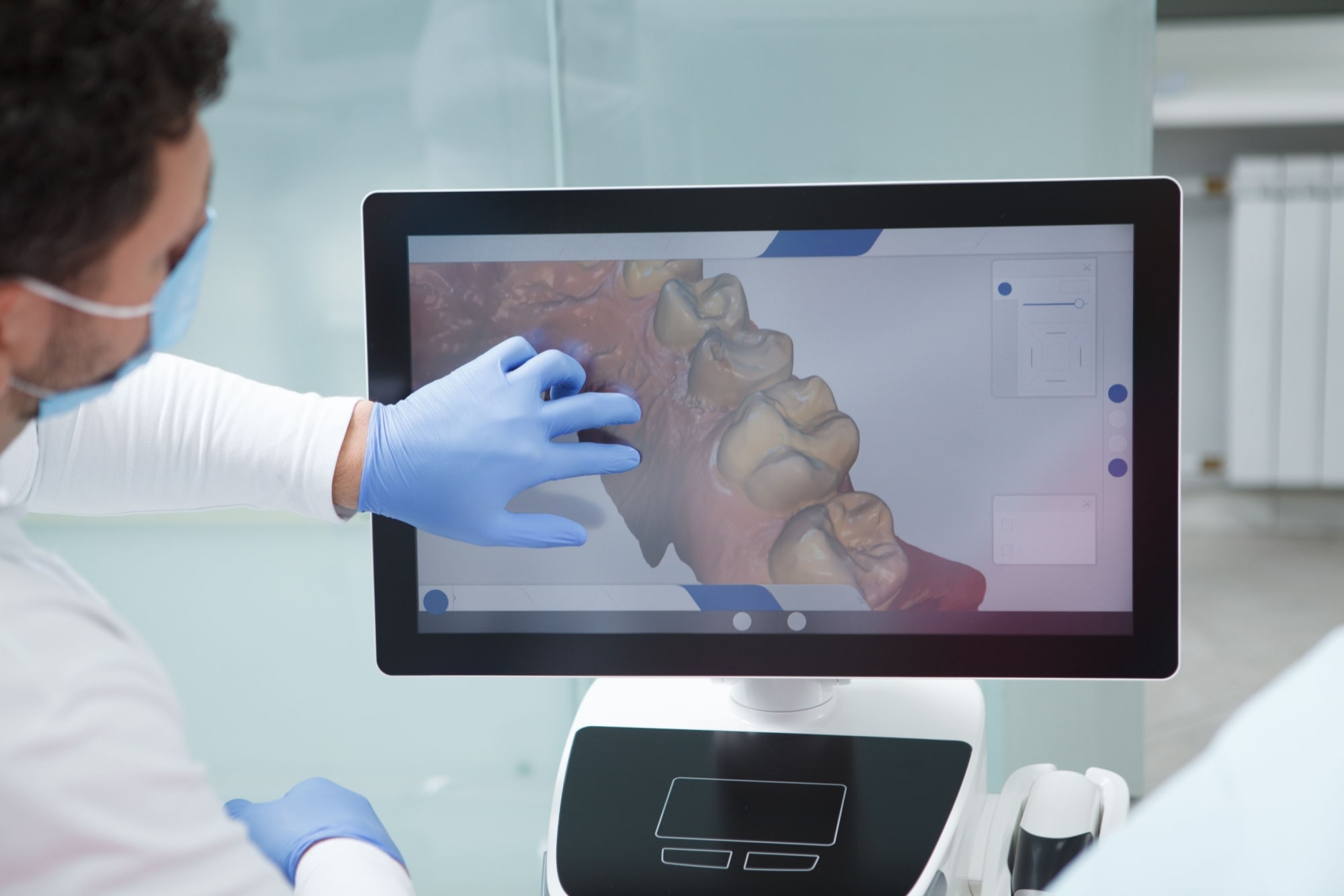 Dentist examining dental scan of a patient 